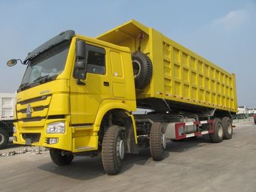 SINOTRUK Howo 8×4 isuzu 덤프 트럭은 70 톤 30CBM 하치장 상자 모형 ZZ3317N4667A를 적재합니다